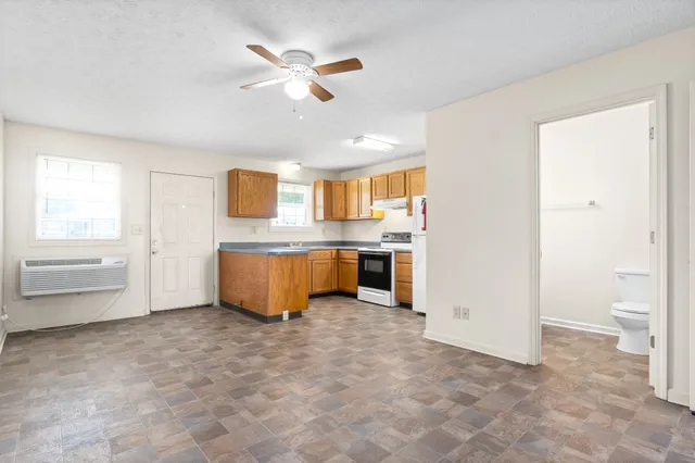 a view of a kitchen with a dishwasher and a microwave