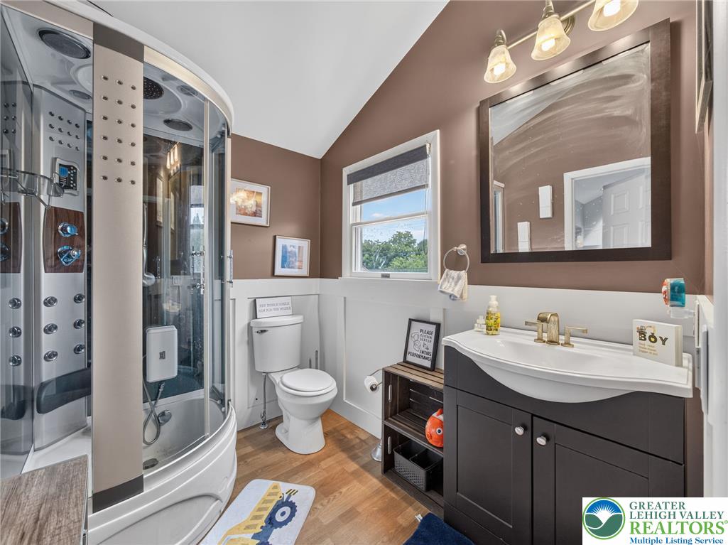 2628 Levans Road Coplay, PA 18037 - Photo 39 of 54 A well-appointed bath features a shower spa system and a functional vanity with elegant fixtures.