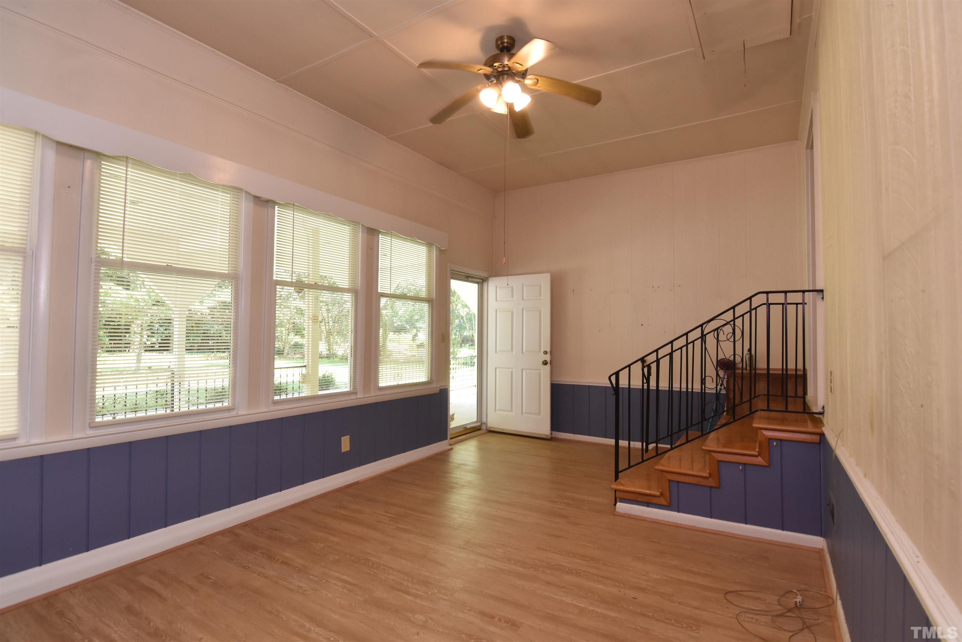 1226 Weeks Road Dunn, NC 28334 - Photo 17 of 43 a view of an empty room with a window and wooden floor