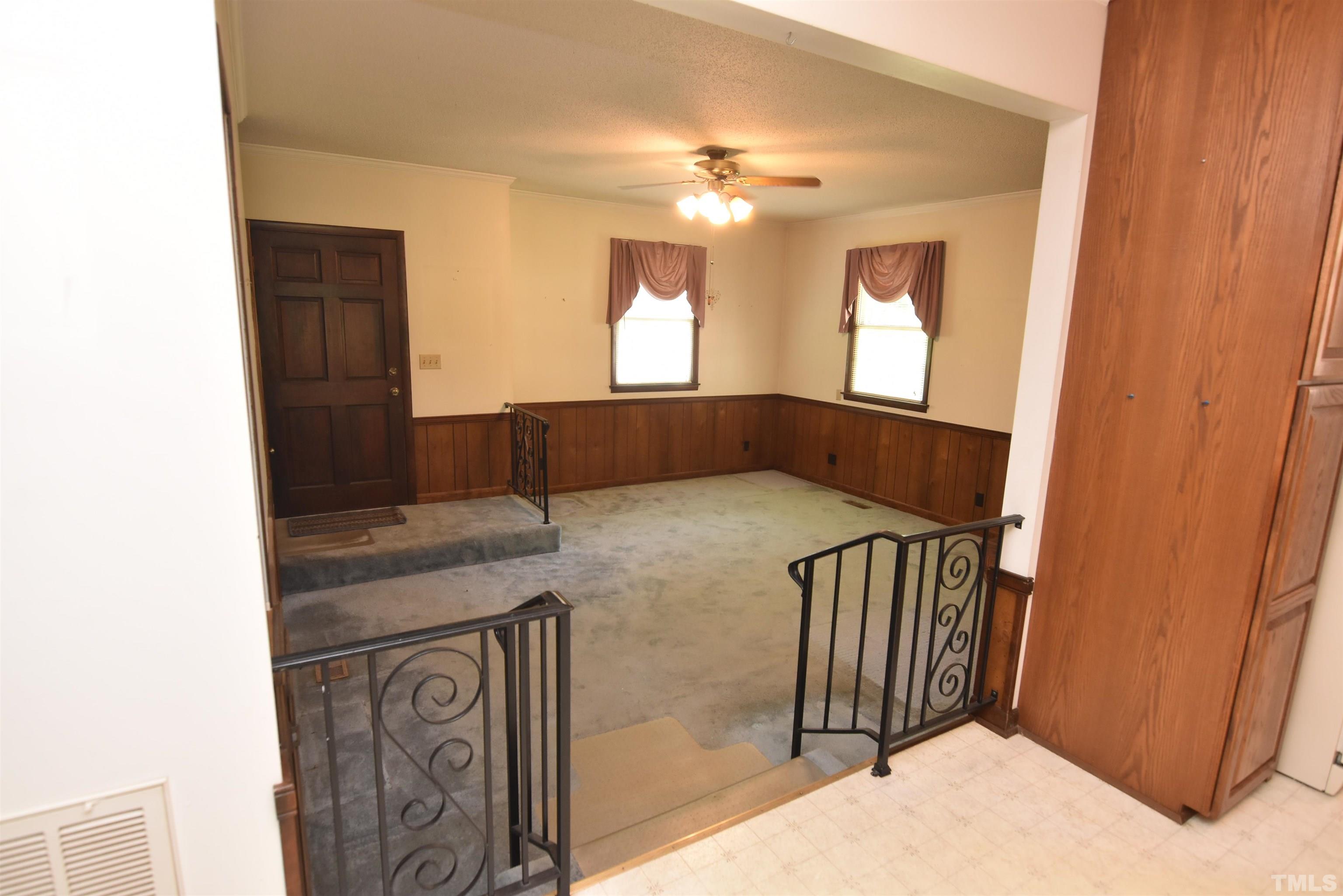 1226 Weeks Road Dunn, NC 28334 - Photo 21 of 43 a bedroom with a bed and a mirror