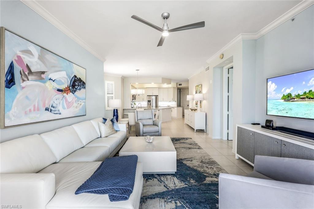 400 Flagship Drive, Unit 908 Naples, FL 34108 - Photo 17 of 27 a living room with furniture and a flat screen tv