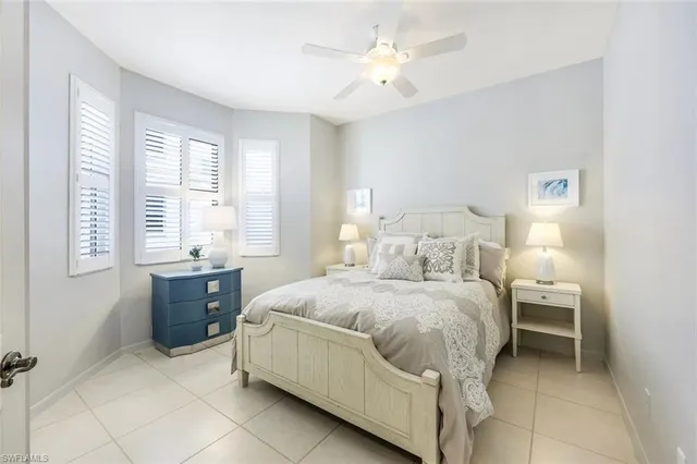 a bedroom with a bed and a table