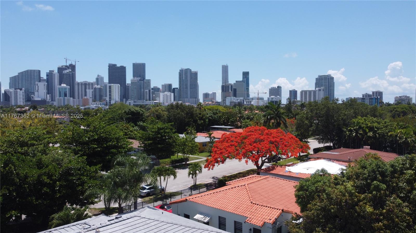 a view of a city with tall buildings