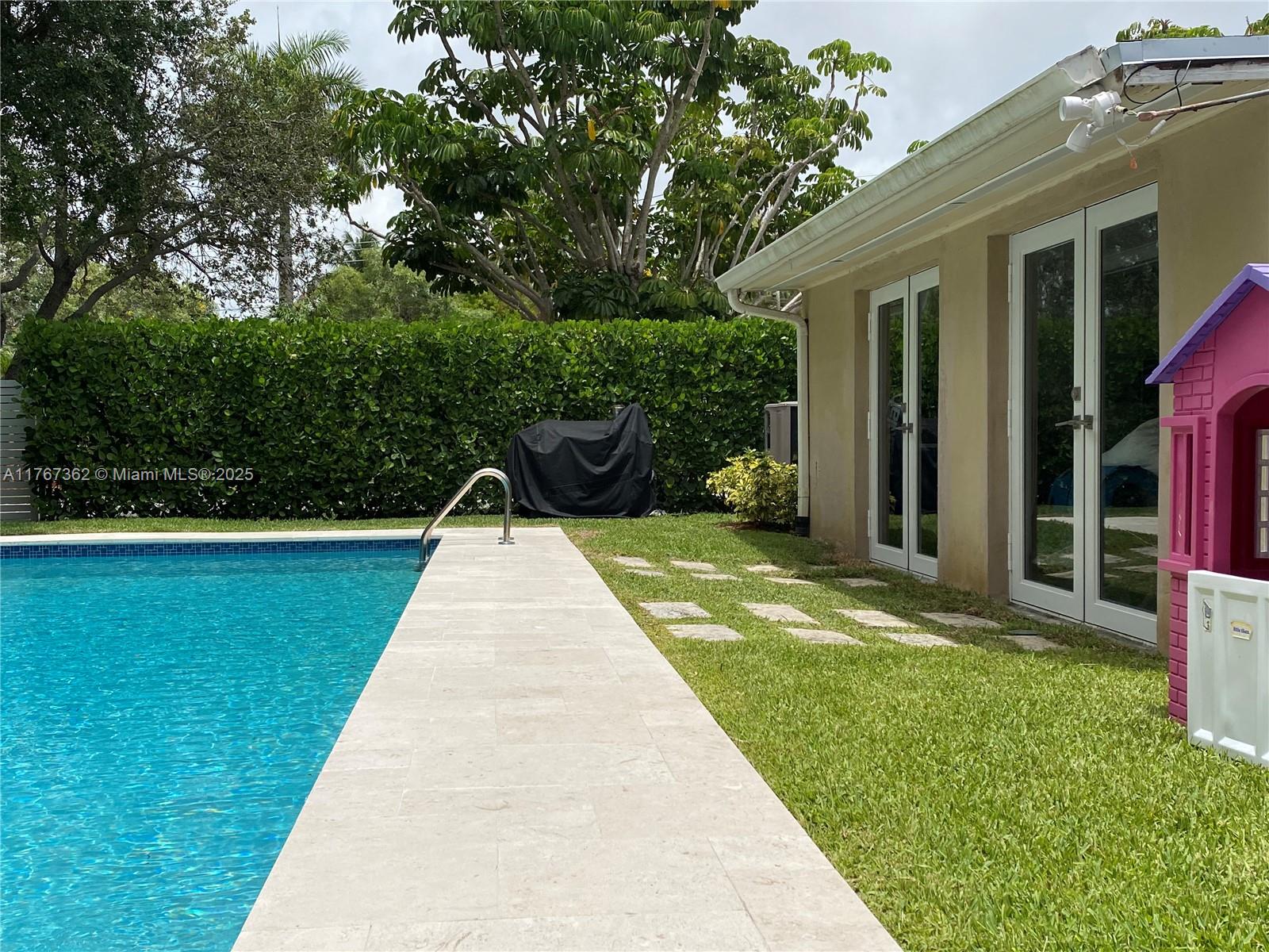 790 Southwest 21st Road Miami, FL 33129 - Photo 13 of 83 New Travertine Pavers (Anti Slip) finishings and freshly diamond brighted pool