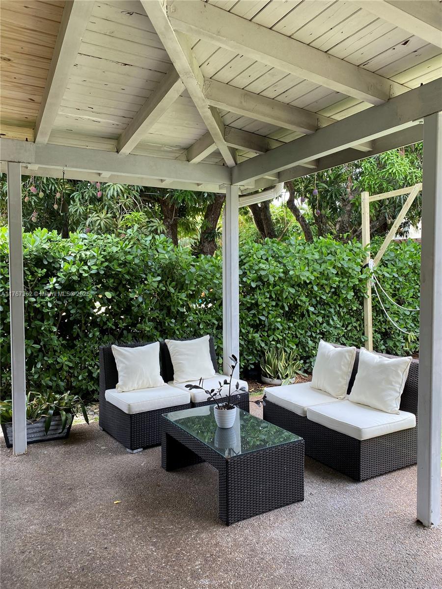 790 Southwest 21st Road Miami, FL 33129 - Photo 19 of 83 a outdoor living space with furniture and garden view