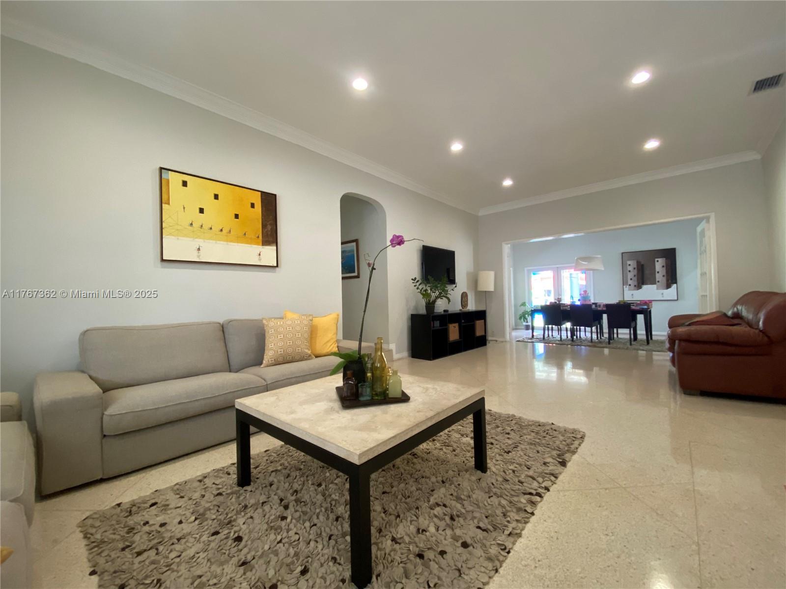 790 Southwest 21st Road Miami, FL 33129 - Photo 24 of 83 a living room with furniture and a table