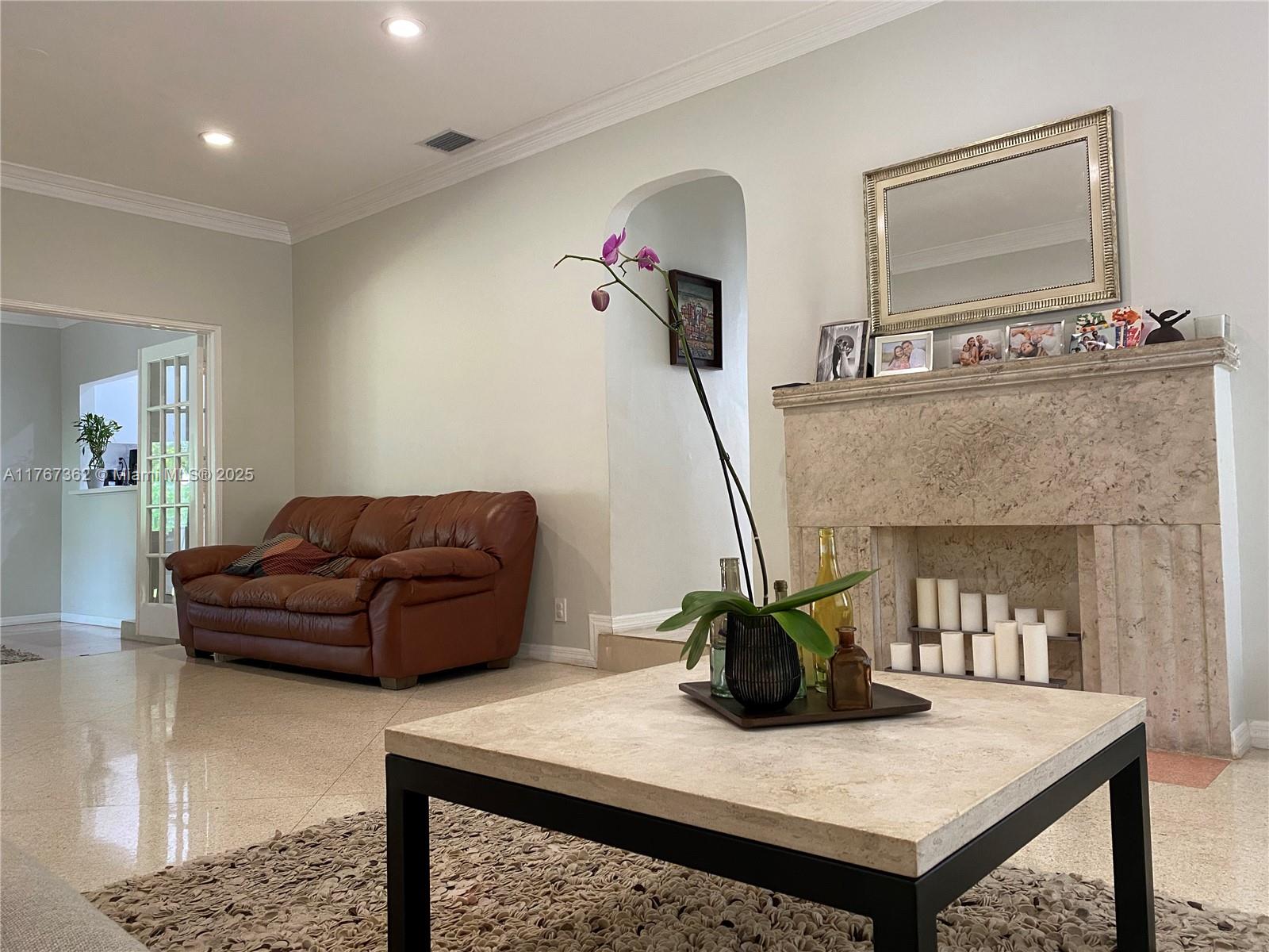 790 Southwest 21st Road Miami, FL 33129 - Photo 25 of 83 a living room with furniture and a fireplace