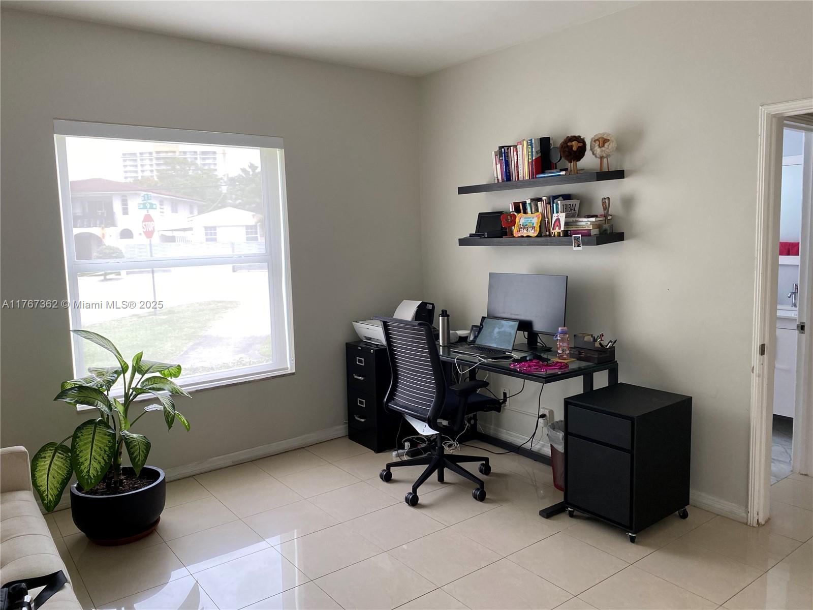 790 Southwest 21st Road Miami, FL 33129 - Photo 35 of 83 a view of a workspace with furniture and a window