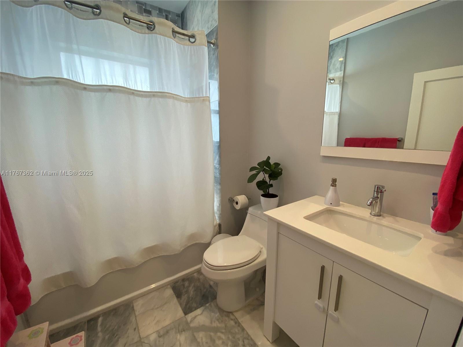 790 Southwest 21st Road Miami, FL 33129 - Photo 37 of 83 a bathroom with a sink a toilet and shower