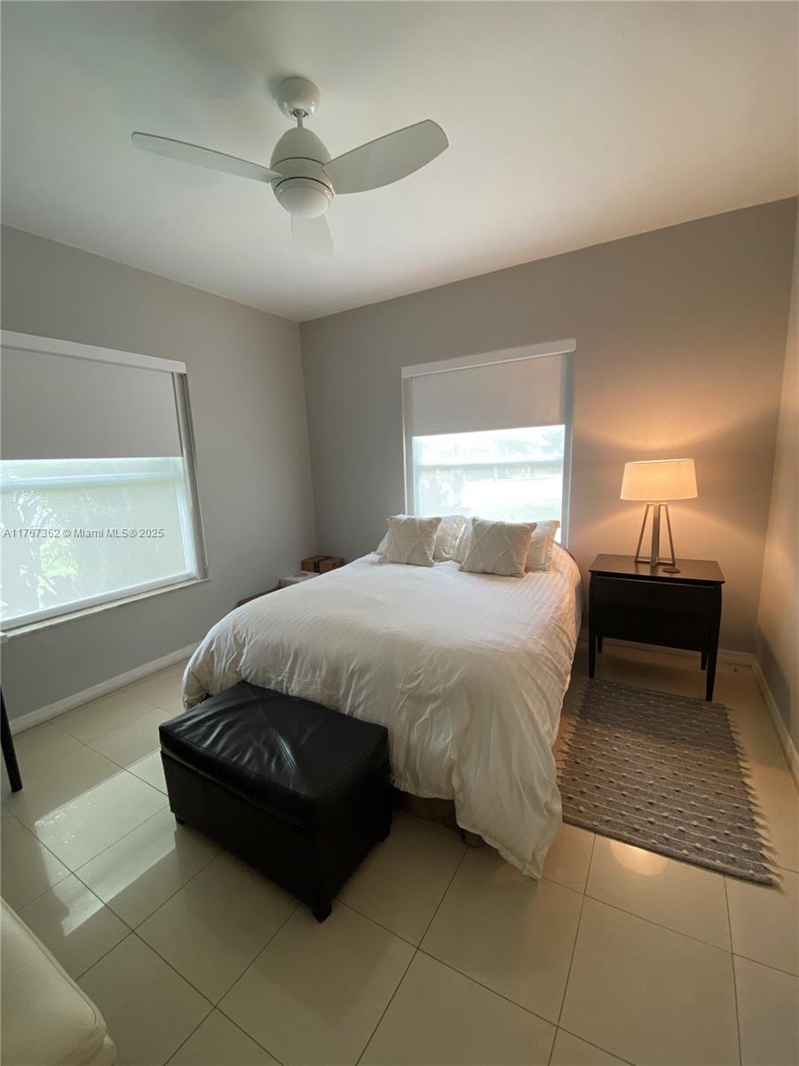 790 Southwest 21st Road Miami, FL 33129 - Photo 39 of 83 a spacious bedroom with a bed and a window