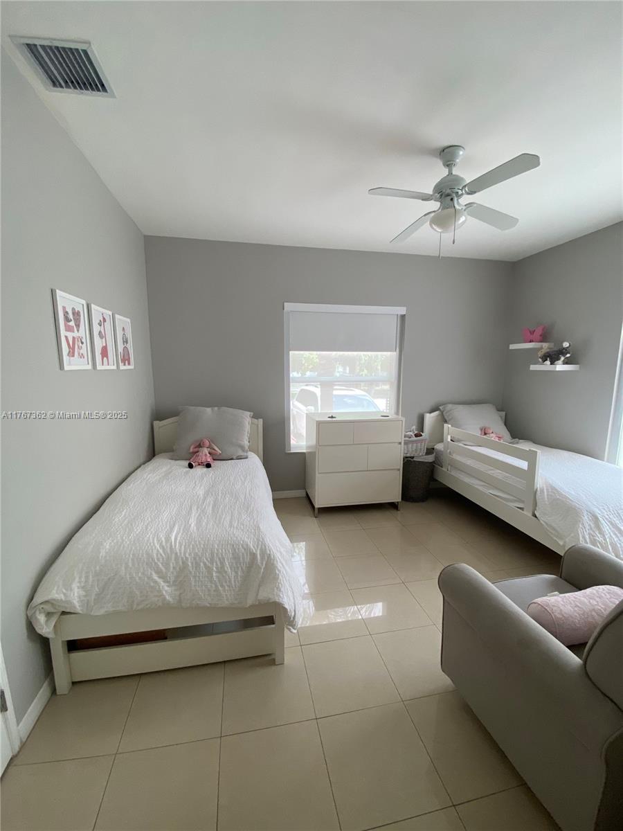 790 Southwest 21st Road Miami, FL 33129 - Photo 45 of 83 a bedroom with bed couch and window