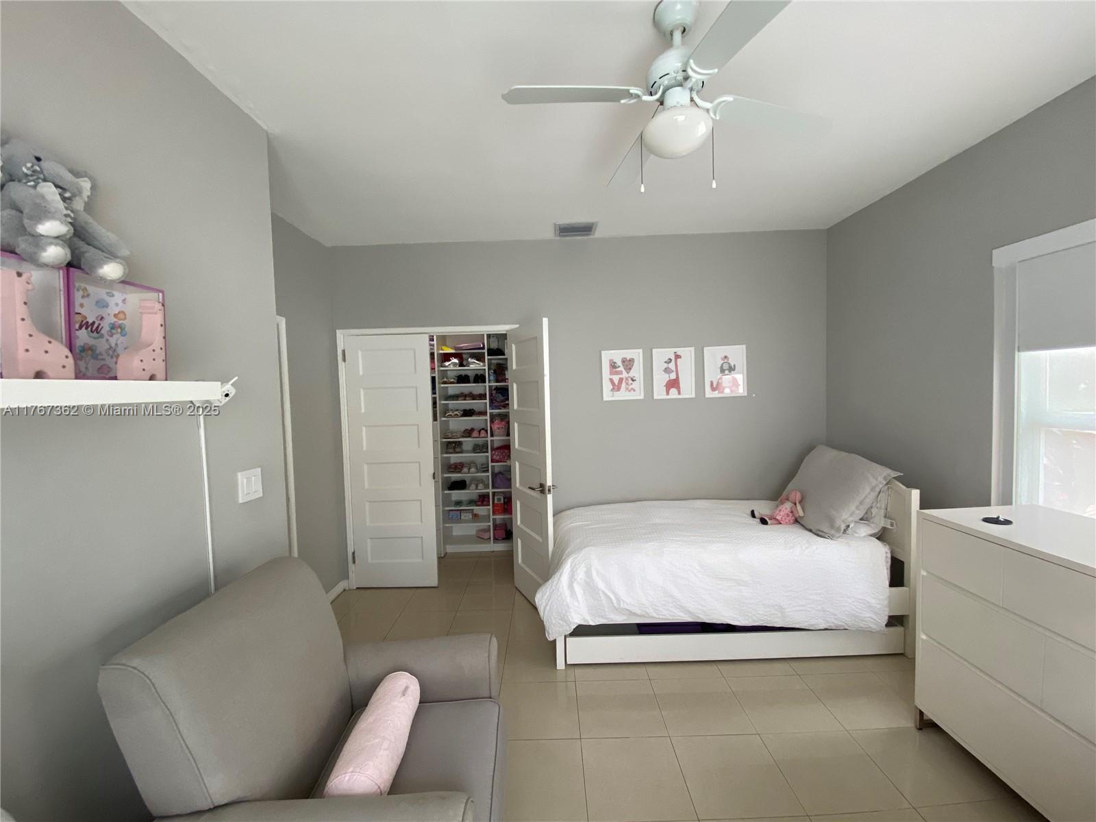 790 Southwest 21st Road Miami, FL 33129 - Photo 48 of 83 a bedroom with a bed and a couch