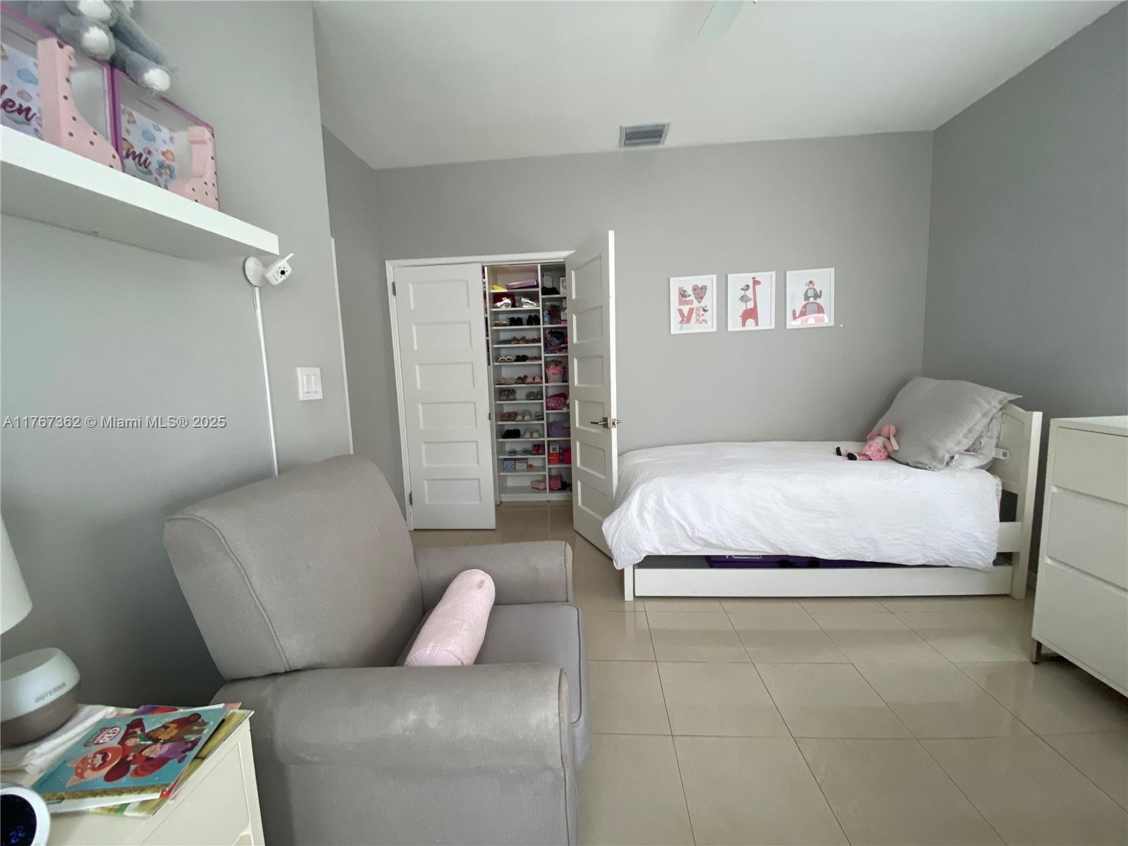 790 Southwest 21st Road Miami, FL 33129 - Photo 49 of 83 a bedroom with a bed and a couch