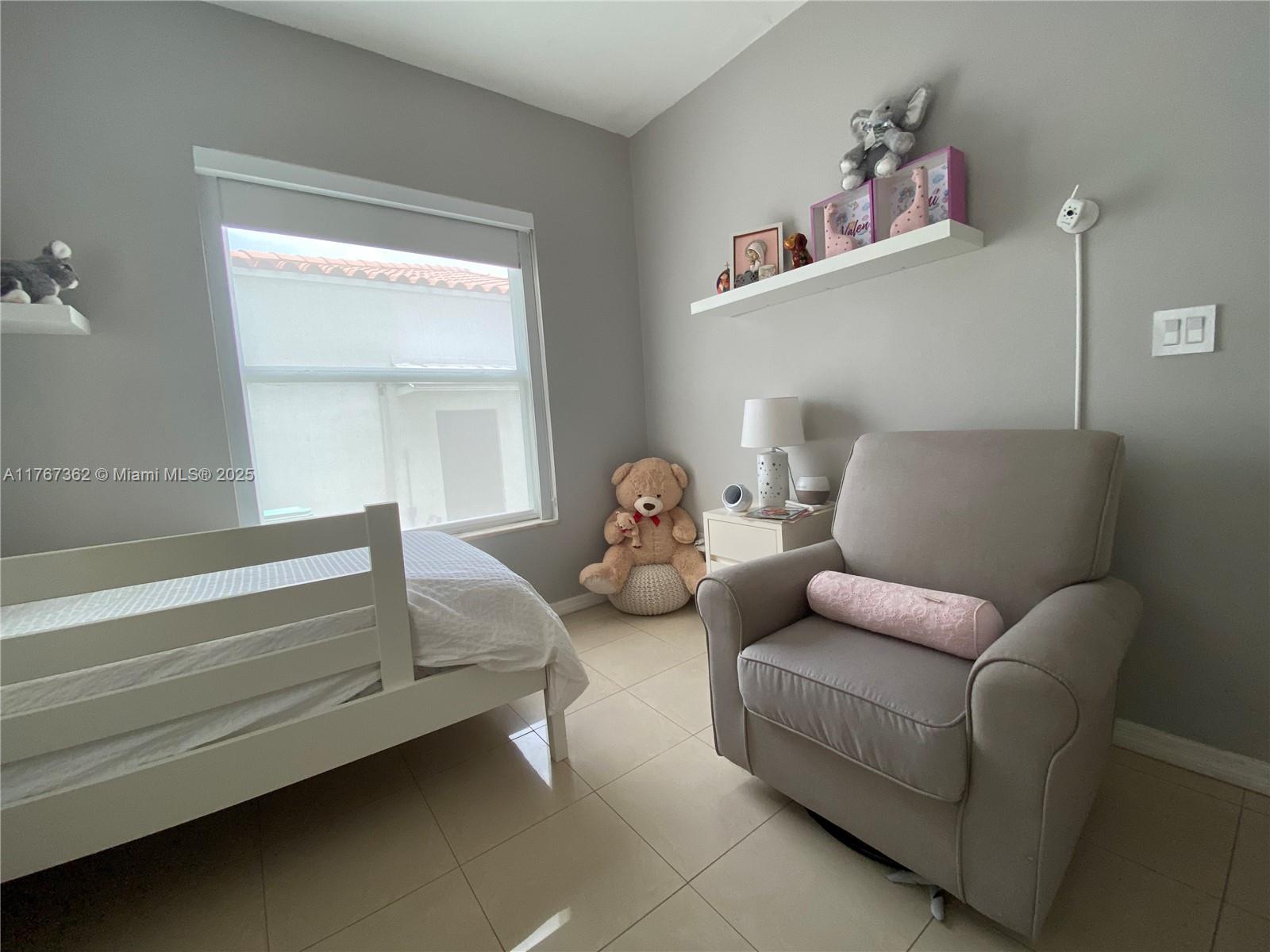 790 Southwest 21st Road Miami, FL 33129 - Photo 52 of 83 a living room with furniture and a window