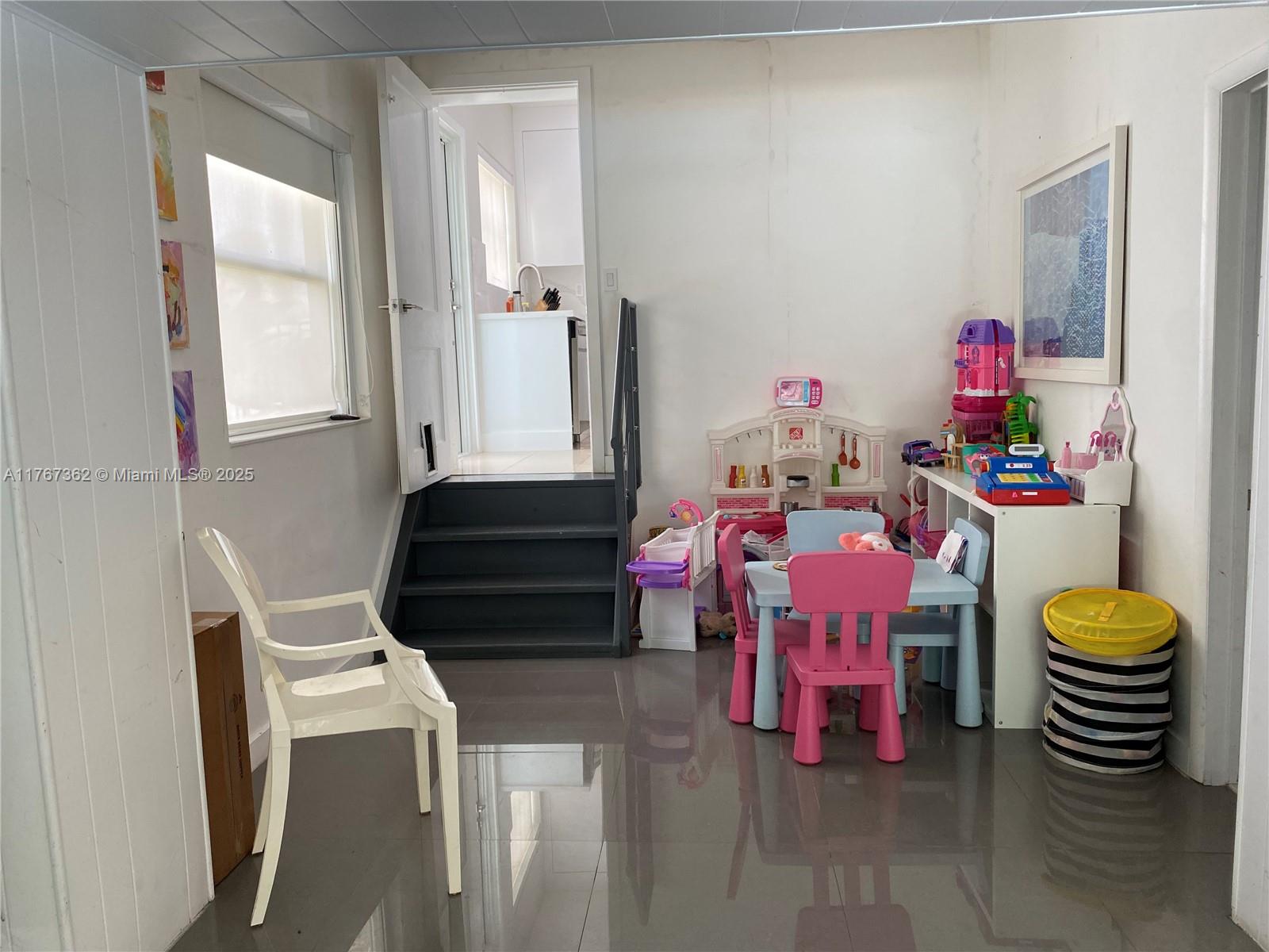 790 Southwest 21st Road Miami, FL 33129 - Photo 54 of 83 a living room with furniture and a chair