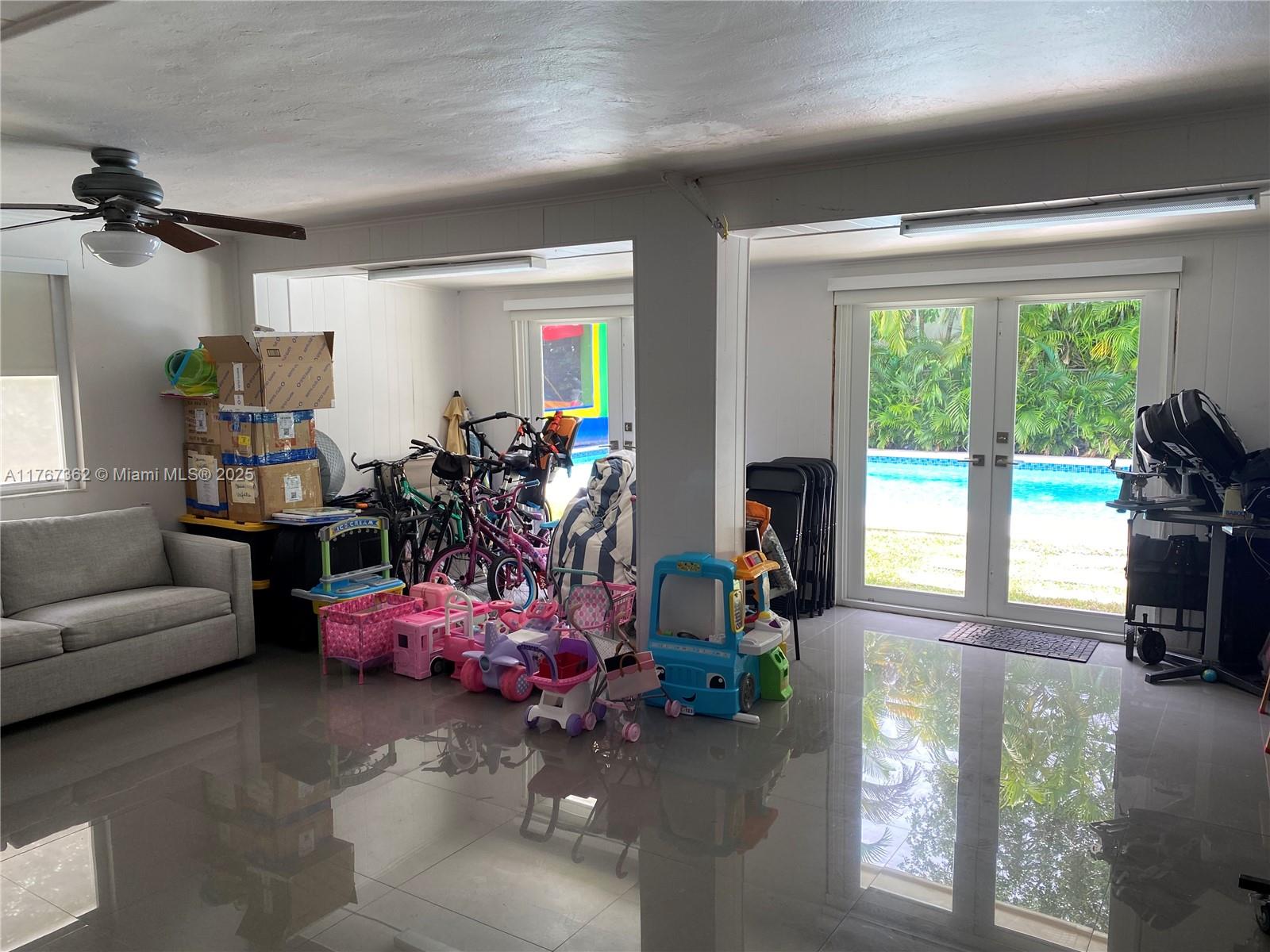 790 Southwest 21st Road Miami, FL 33129 - Photo 56 of 83 a living room with furniture and a large window