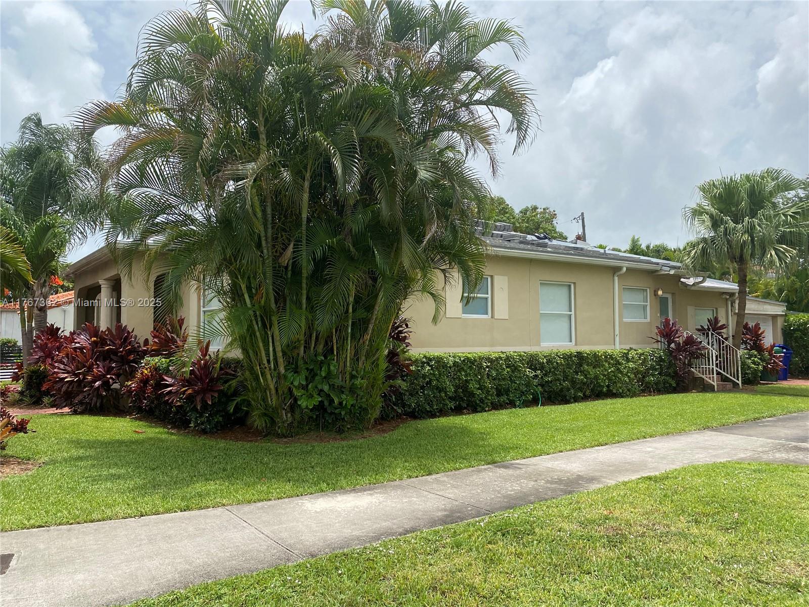 790 Southwest 21st Road Miami, FL 33129 - Photo 61 of 83 a front view of a house with a garden