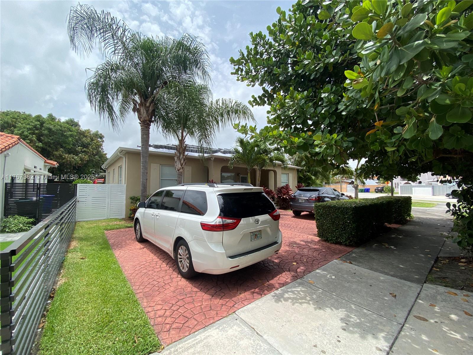 790 Southwest 21st Road Miami, FL 33129 - Photo 68 of 83 a front view of a house with garden and sitting area