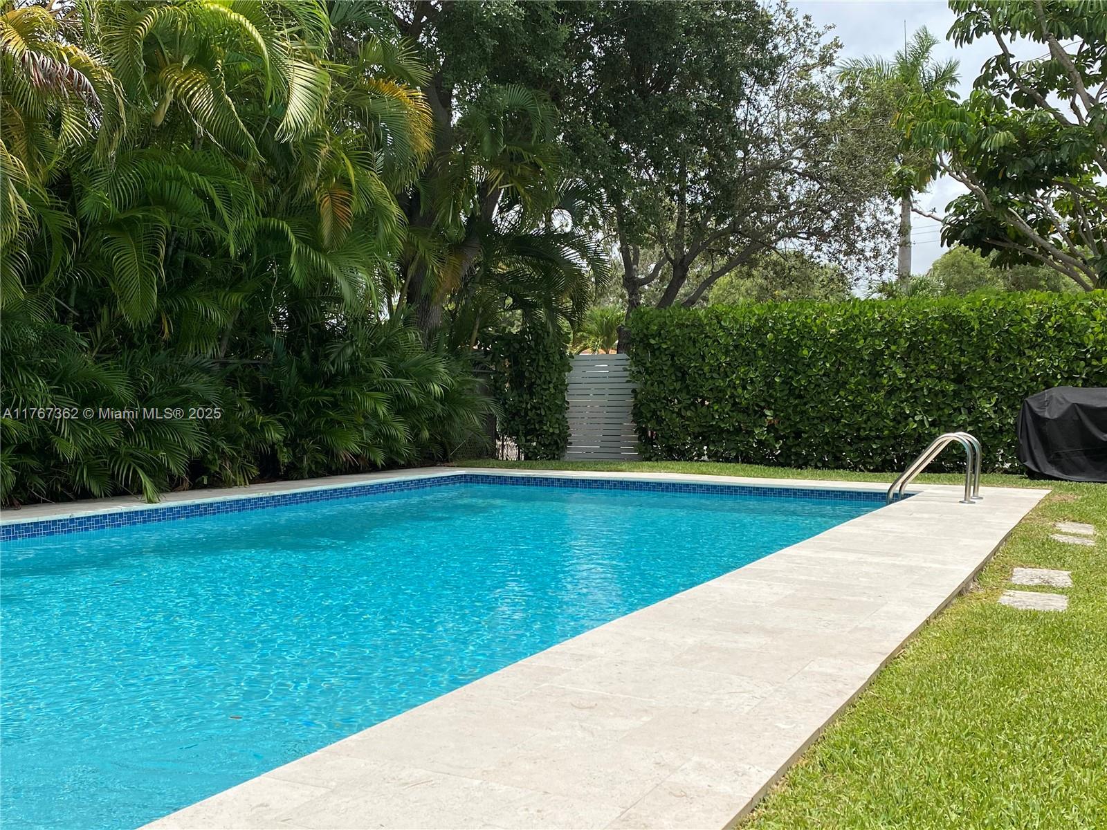790 Southwest 21st Road Miami, FL 33129 - Photo 9 of 83 a view of a swimming pool with an outdoor space