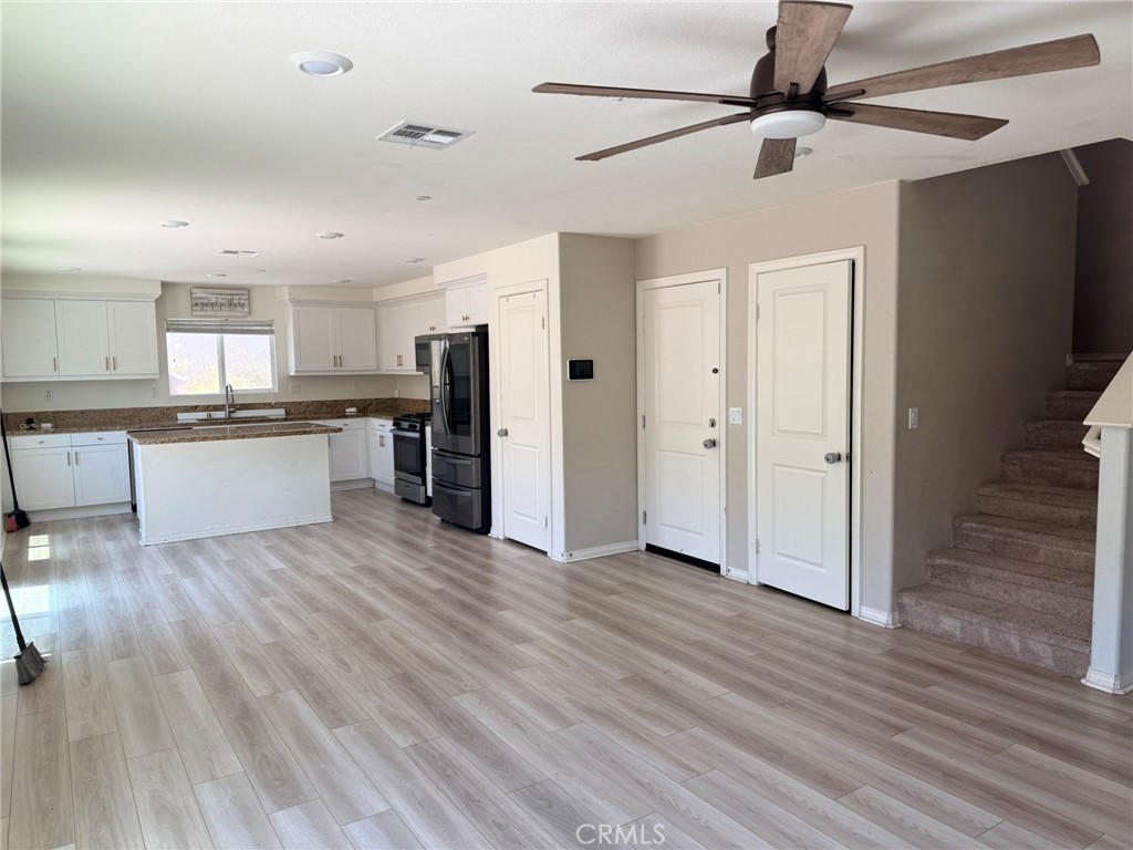 32201 Rambling Court Winchester, CA 92596 - Photo 4 of 11 a large kitchen with stainless steel appliances granite countertop a stove and a refrigerator