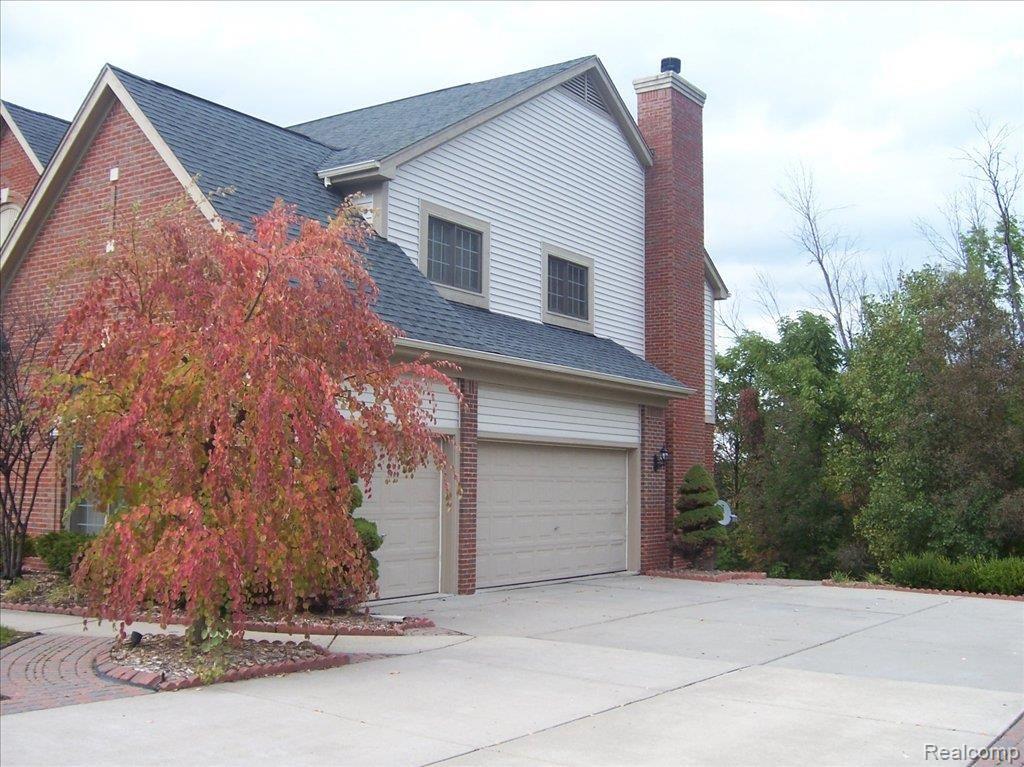 1130 Indianpipe Road Lake Orion, MI 48360 - Photo 3 of 25 3 Car Side-Entry Garage