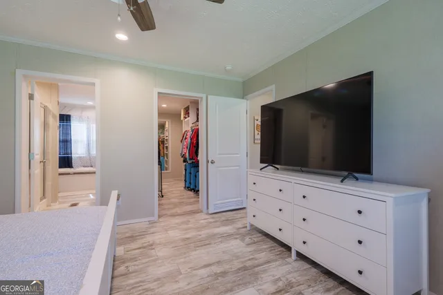 a living room with furniture and flat screen tv