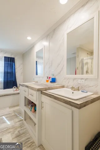 a bathroom with a sink and a mirror