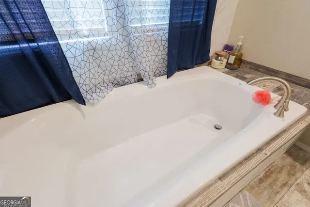 a bathroom with a bathtub