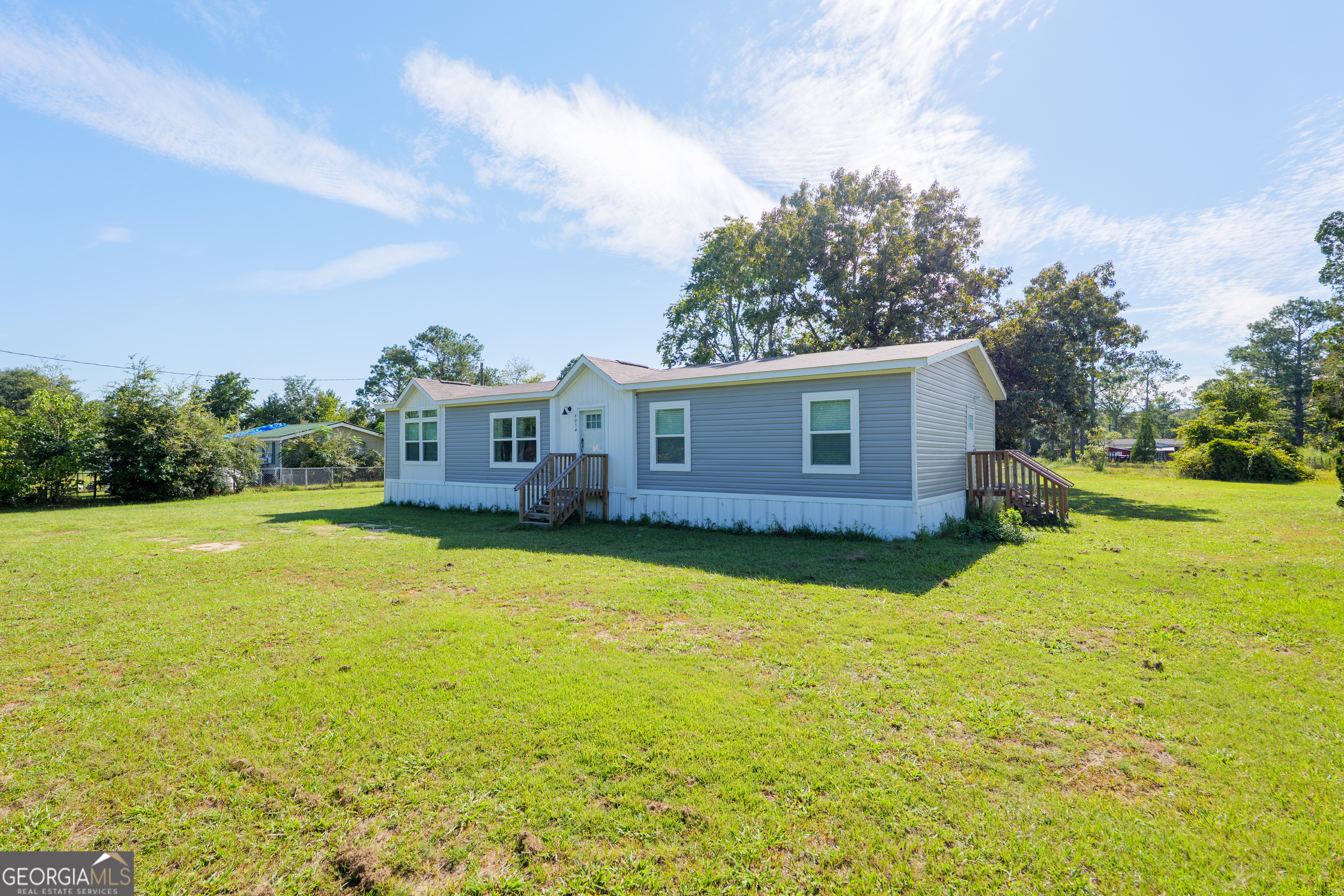 6054 Glenn Road Valdosta, GA 31606 - Photo 2 of 41 a view of a house with backyard and garden