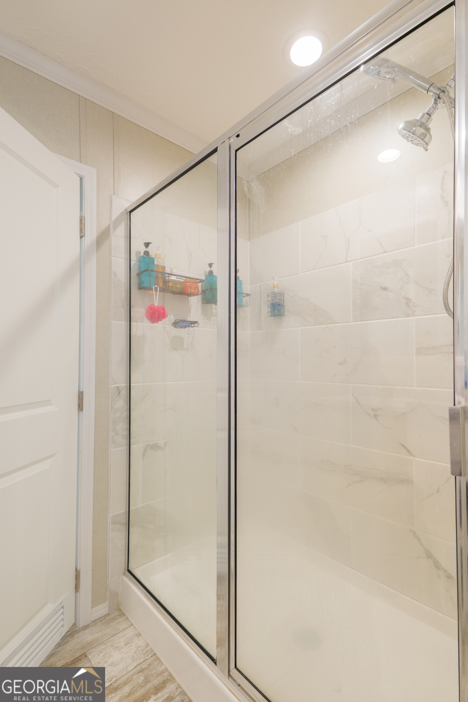 6054 Glenn Road Valdosta, GA 31606 - Photo 21 of 41 a bathroom with a glass shower door