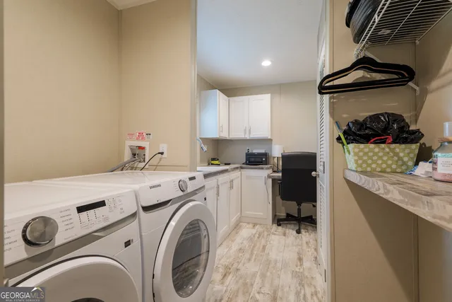 a storage room with washer and dryer