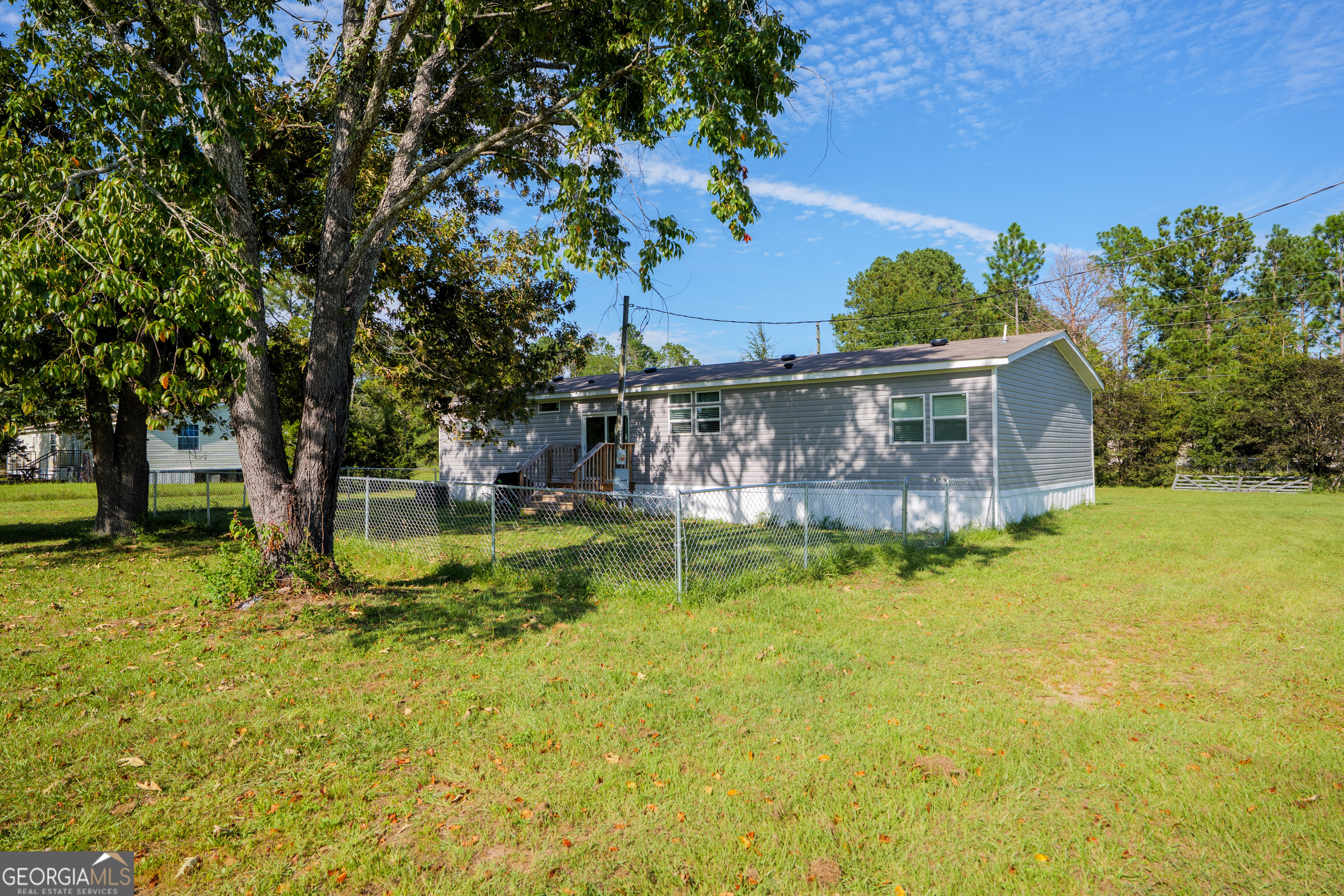 6054 Glenn Road Valdosta, GA 31606 - Photo 33 of 41 a view of a garden with a bench