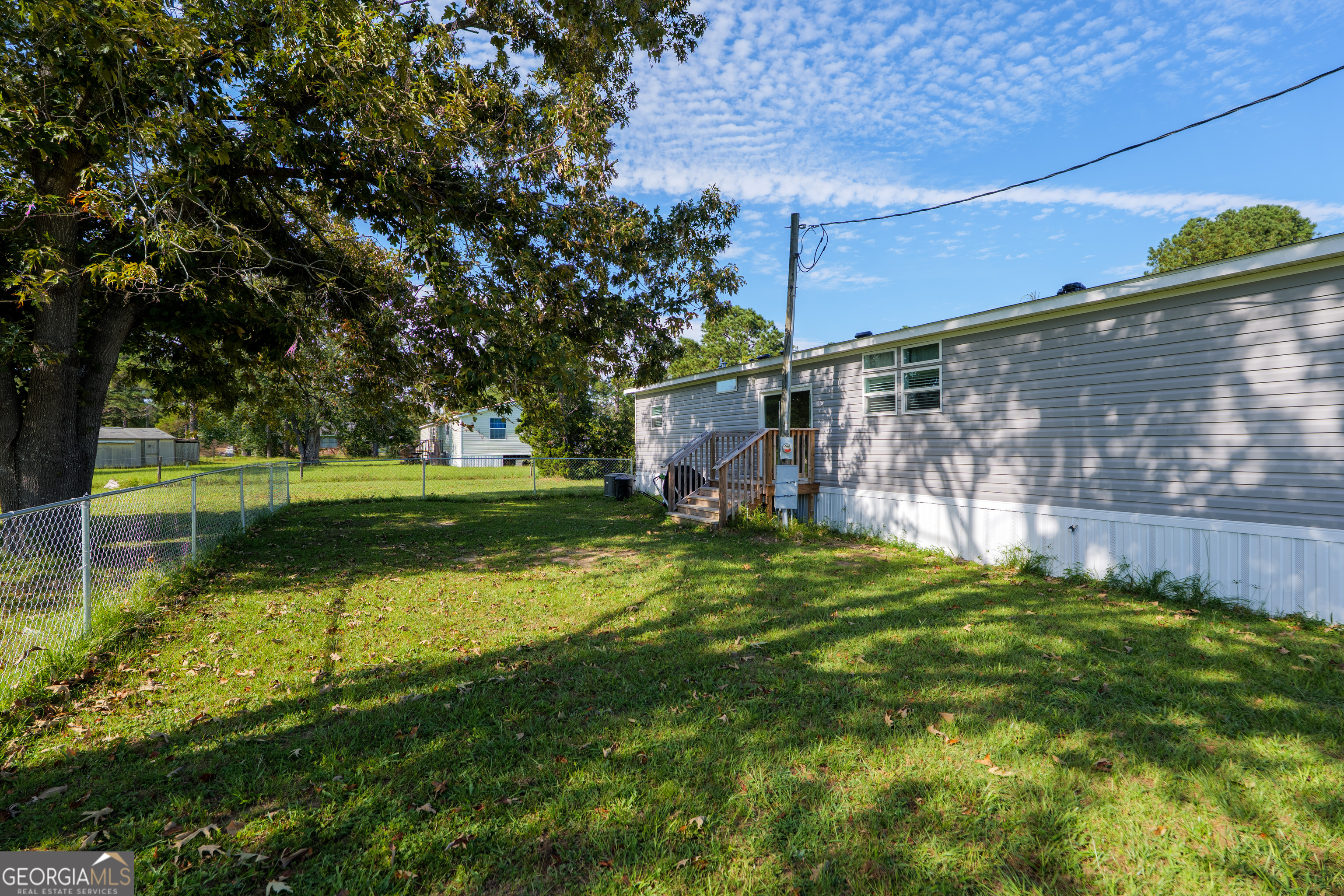 6054 Glenn Road Valdosta, GA 31606 - Photo 34 of 41 a backyard of a house with lots of green space