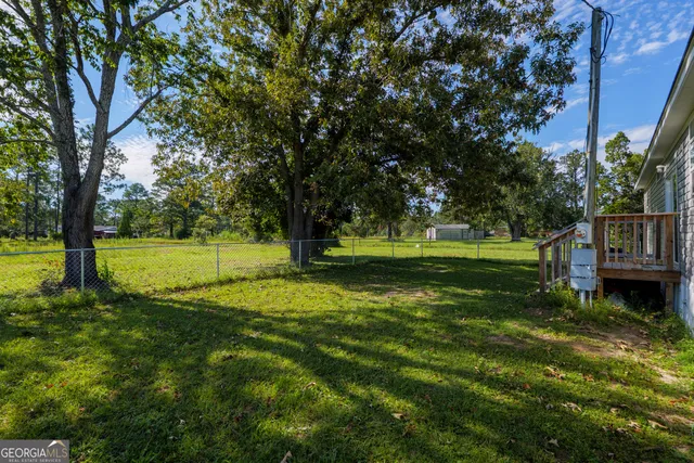 a view of a park with large trees