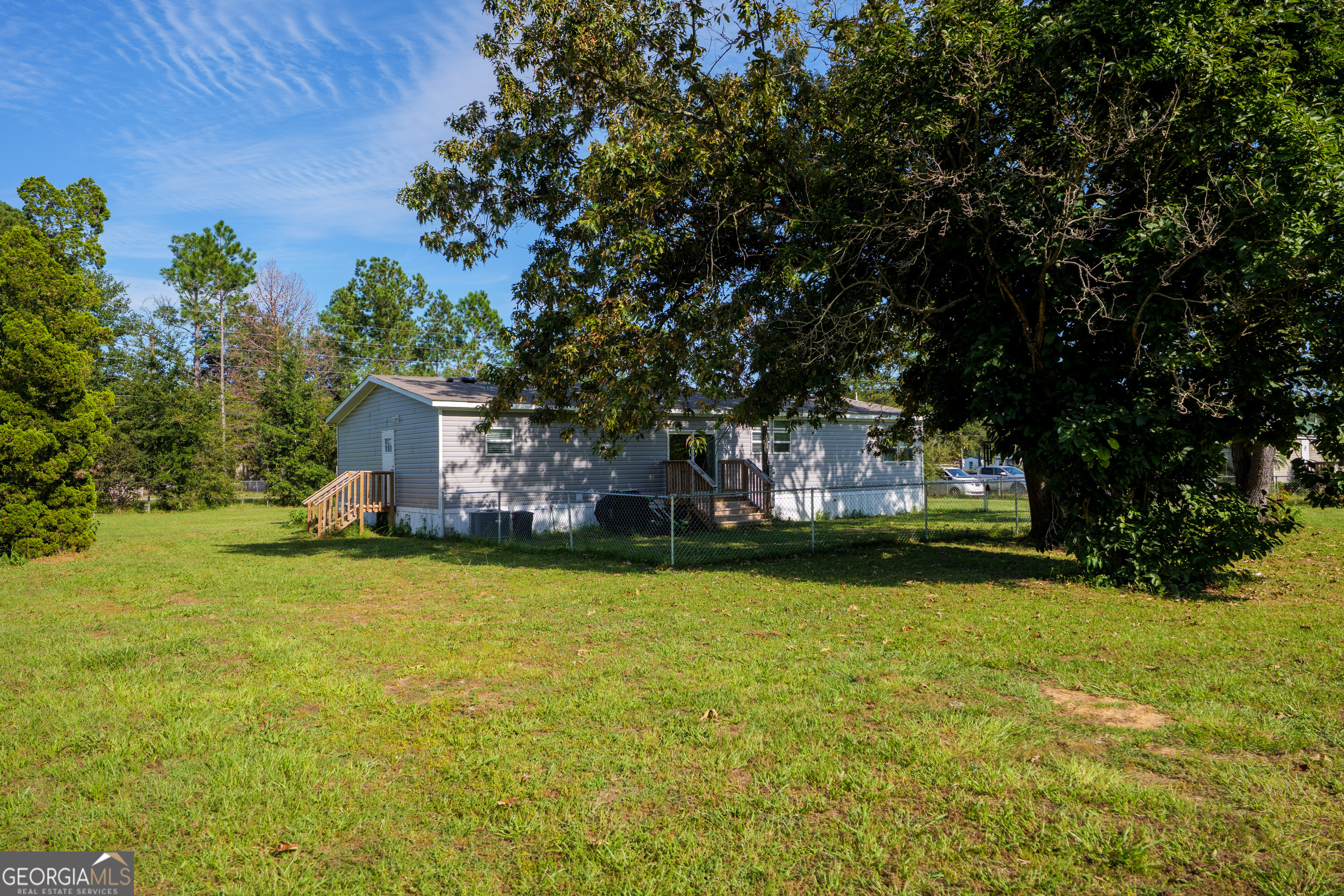 6054 Glenn Road Valdosta, GA 31606 - Photo 37 of 41 a house with swimming pool in front of it