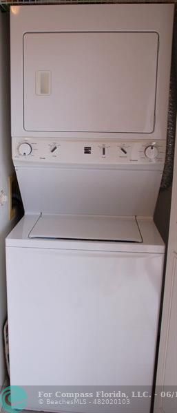 448 Pine Glen Lane, Unit E Greenacres, FL 33463 - Photo 11 of 35 a close up view of washer and dryer