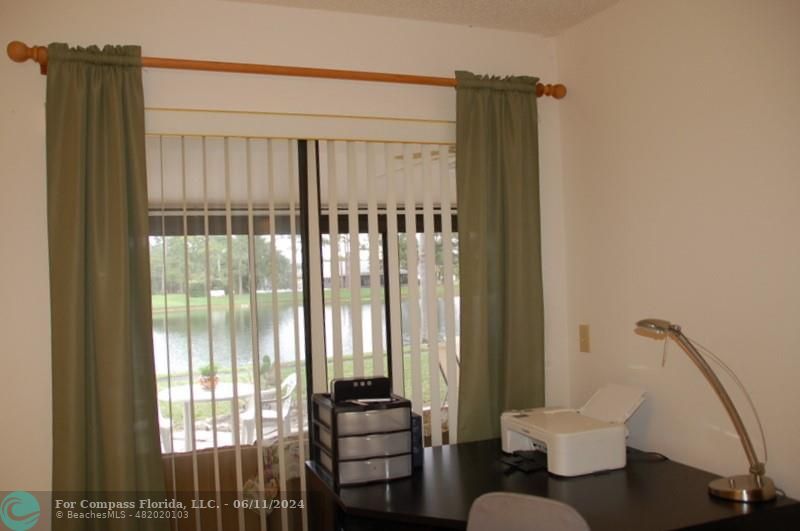 448 Pine Glen Lane, Unit E Greenacres, FL 33463 - Photo 13 of 35 a living room with furniture and a window