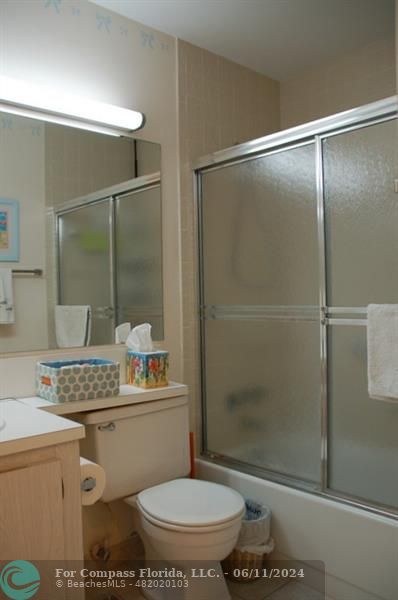 448 Pine Glen Lane, Unit E Greenacres, FL 33463 - Photo 18 of 35 a bathroom with a shower a toilet and a sink