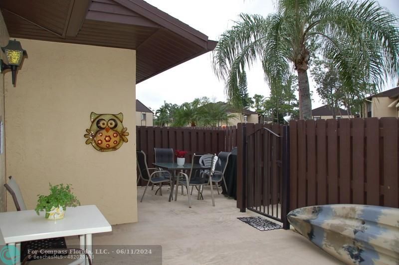 448 Pine Glen Lane, Unit E Greenacres, FL 33463 - Photo 22 of 35 a view of outdoor space with furniture