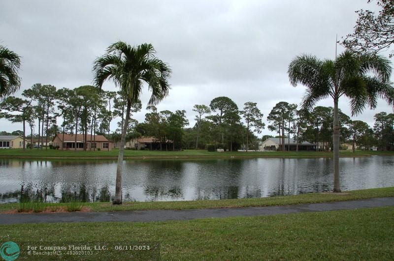 448 Pine Glen Lane, Unit E Greenacres, FL 33463 - Photo 3 of 35 a view of a lake with a lake view