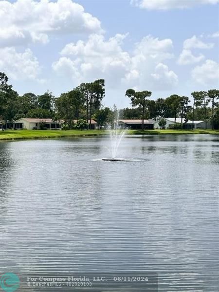 448 Pine Glen Lane, Unit E Greenacres, FL 33463 - Photo 34 of 35 a view of lake view and mountain