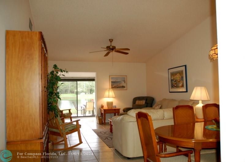 448 Pine Glen Lane, Unit E Greenacres, FL 33463 - Photo 4 of 35 a living room with furniture and a window