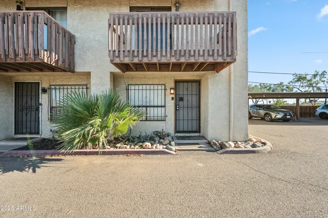 a group of cars parked in front of a house