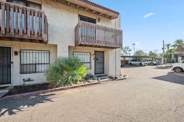 a front view of a building with garden