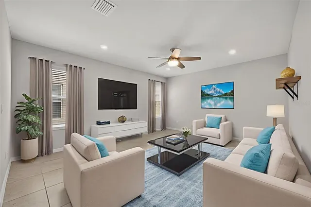a living room with furniture and a flat screen tv