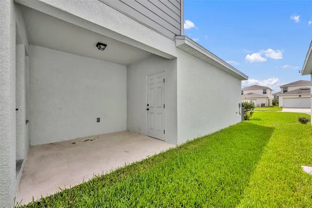 a view of backyard with trampoline