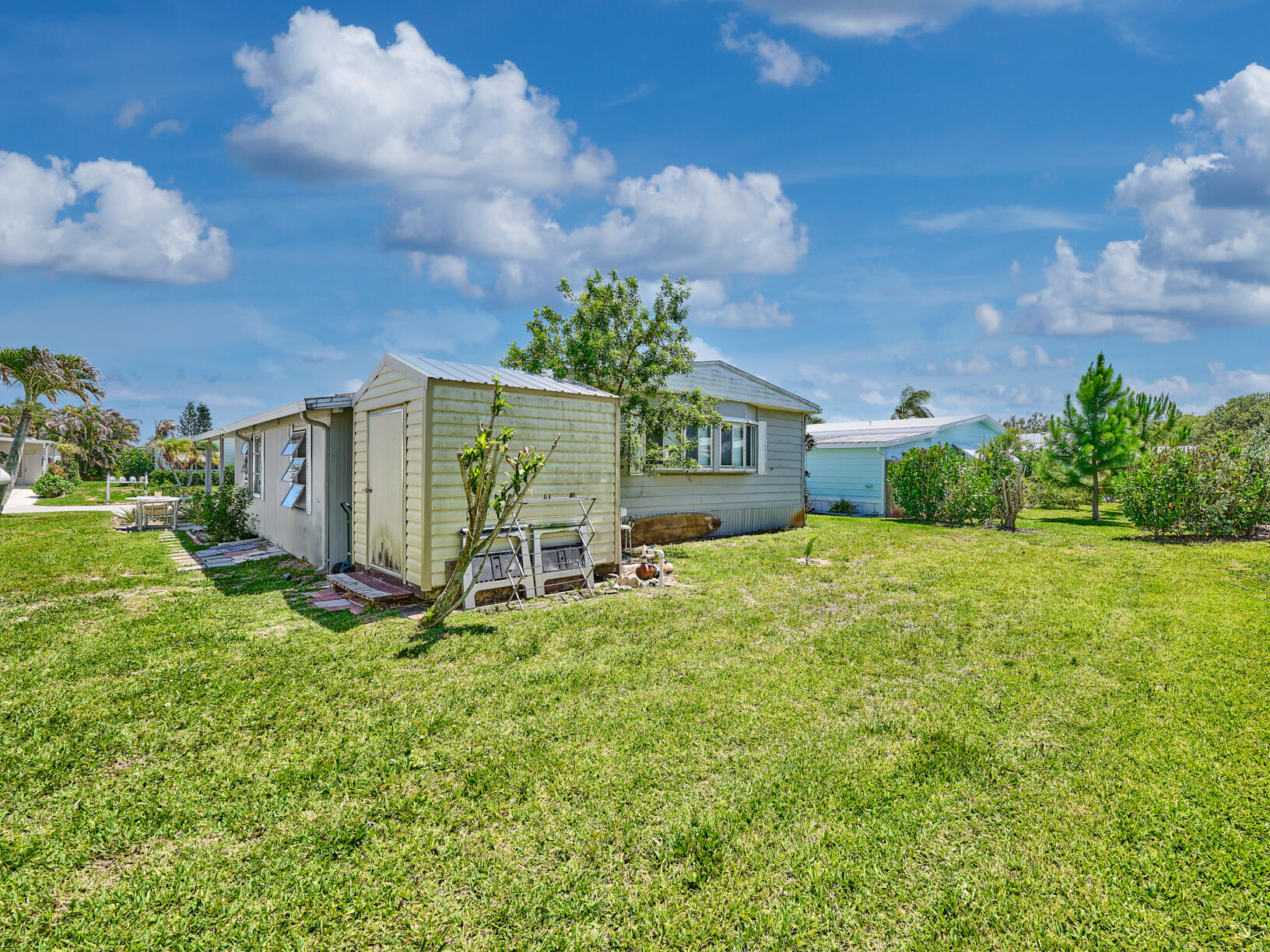 6977 Southeast Delegate Street Hobe Sound, FL 33455 - Photo 47 of 60 a house view with garden space