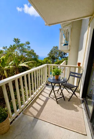 a view of balcony with furniture