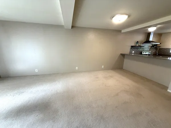 a kitchen with stainless steel appliances granite countertop a stove and a sink