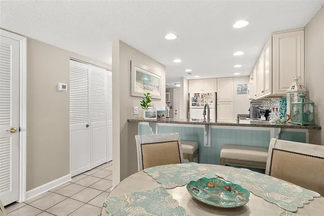 a kitchen with a table and chairs in it